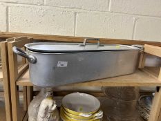 An aluminium fish kettle