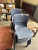 A set of eight plastic sebel postura stacking chairs