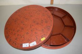 A Burmese circular box with fitted interior