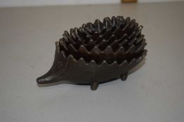 A Greek cast metal hedgehog stacking ashtray
