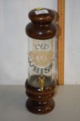 Countertop whisky dispenser on turned wooden base
