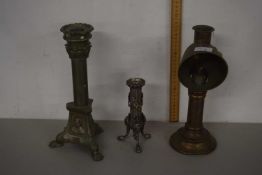 A brass candle stand together with two further candlesticks (3)