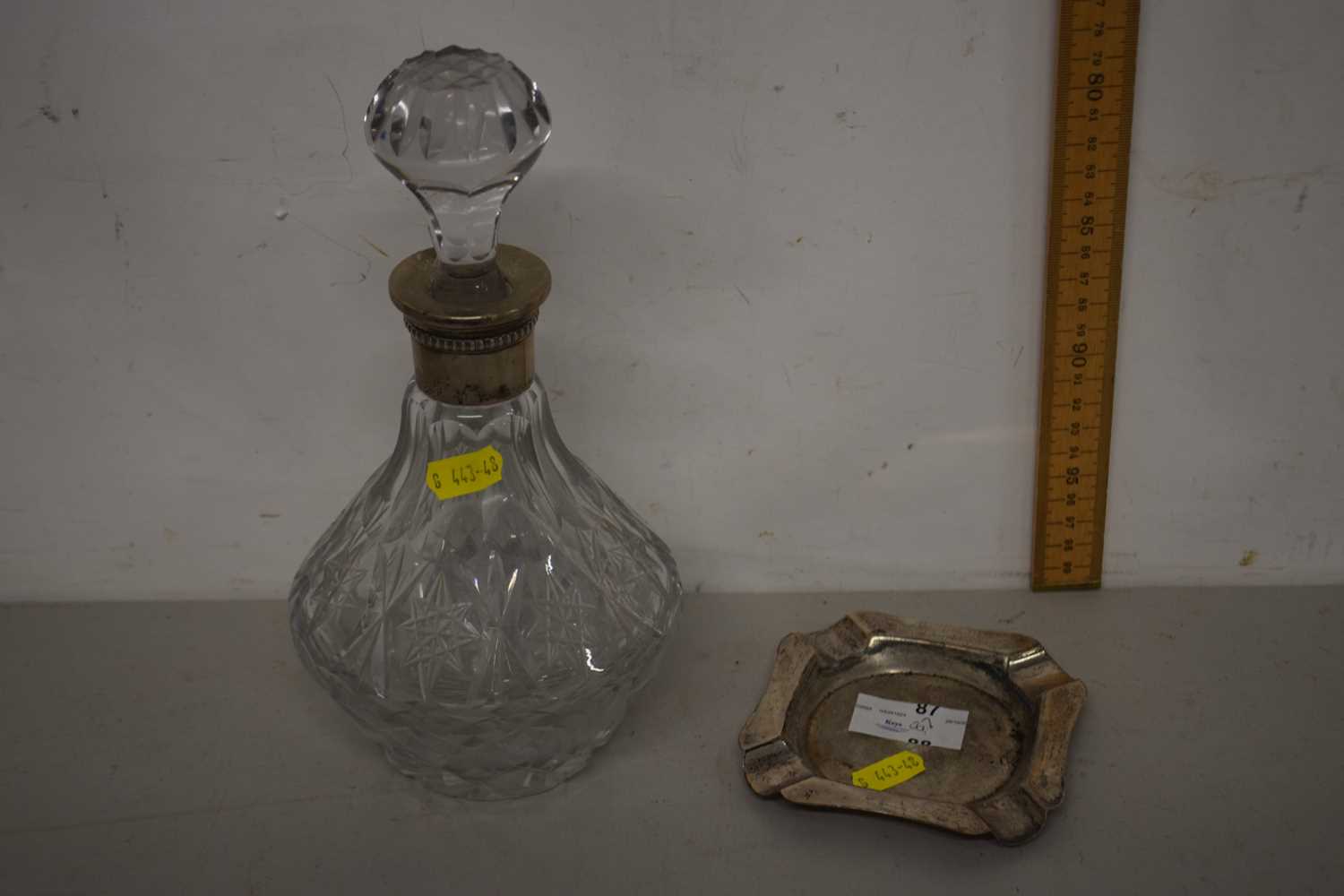 Small hallmarked silver ashtray together with a further decanter with white metal collar
