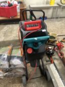 Garden shredder together with a seed spreader