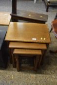 A nest of three oak tables