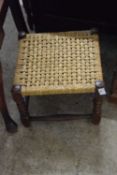 A sisal covered footstool