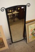 A modern metal framed wall mirror