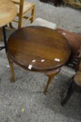 An early 20th Century oak coffee table on cabriole legs