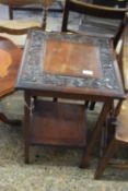 A late 19th Century mahogany occasional table with carved decoration