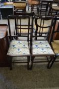 A pair of Edwardian bedroom chairs with floral seats