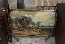 A fire screen decorated with a scene of The Haywain