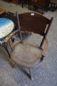 An early 20th Century elm seated revolving desk chair
