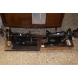 A vintage Singer sewing machine and one other (2)