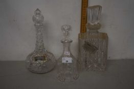 Three decanters, two with plated labels for Port and Sherry