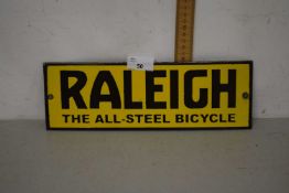 A small rectangular metal advertising plaque for Raleigh Bicycles