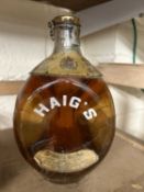 A bottle of vintage Haigs Dimple Scotch Whisky