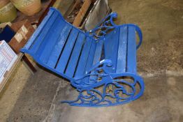 Cast metal and wood outdoor rocking chair
