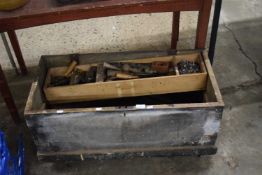 Large wooden toolbox on casters, together with mixed lot of hand tools, saws, spanners, files etc
