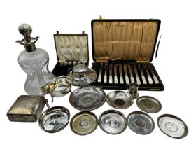 A collection of sterling silver items to include ink well , decanter cigarette box gravy boat etc.