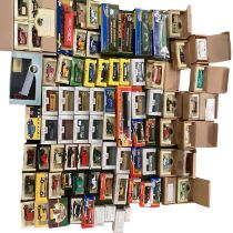 A large collection of boxed reproduction toy cars to include days gone vanguard etc.