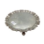 Sterling silver circular card tray raised on three shell feet by Goldsmith and Silversmith company