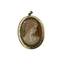 A Cameo locket, with old portrait photo in glass mount verso, engraved to yellow metal rim: from