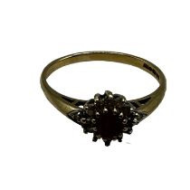 A 9ct gold ruby and diamond set flower ring. Size P. 0.80g.