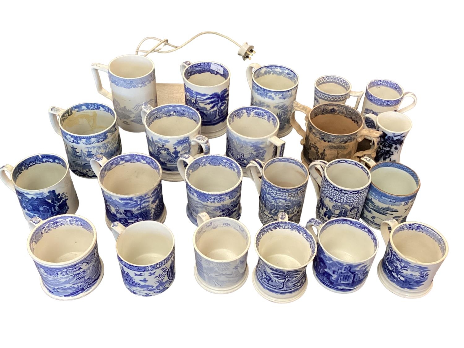 A large collection of blue and white cider mugs, late 18th century to early 20th century, various