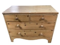 A small pine chest of two short and two long drawers, general wear