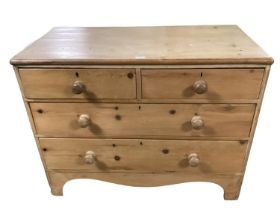 A small pine chest of two short and two long drawers, general wear