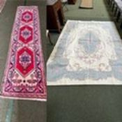 Two rugs: one modern cream ground floral rug with light blue and pink rose pattern