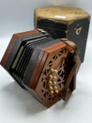 A Lachenal and Co 21 buttons concertina, in carry case.