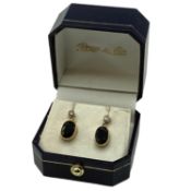 A pair of 18ct gold sapphire and diamond set drop earrings. Oval free cut sapphires in bezel