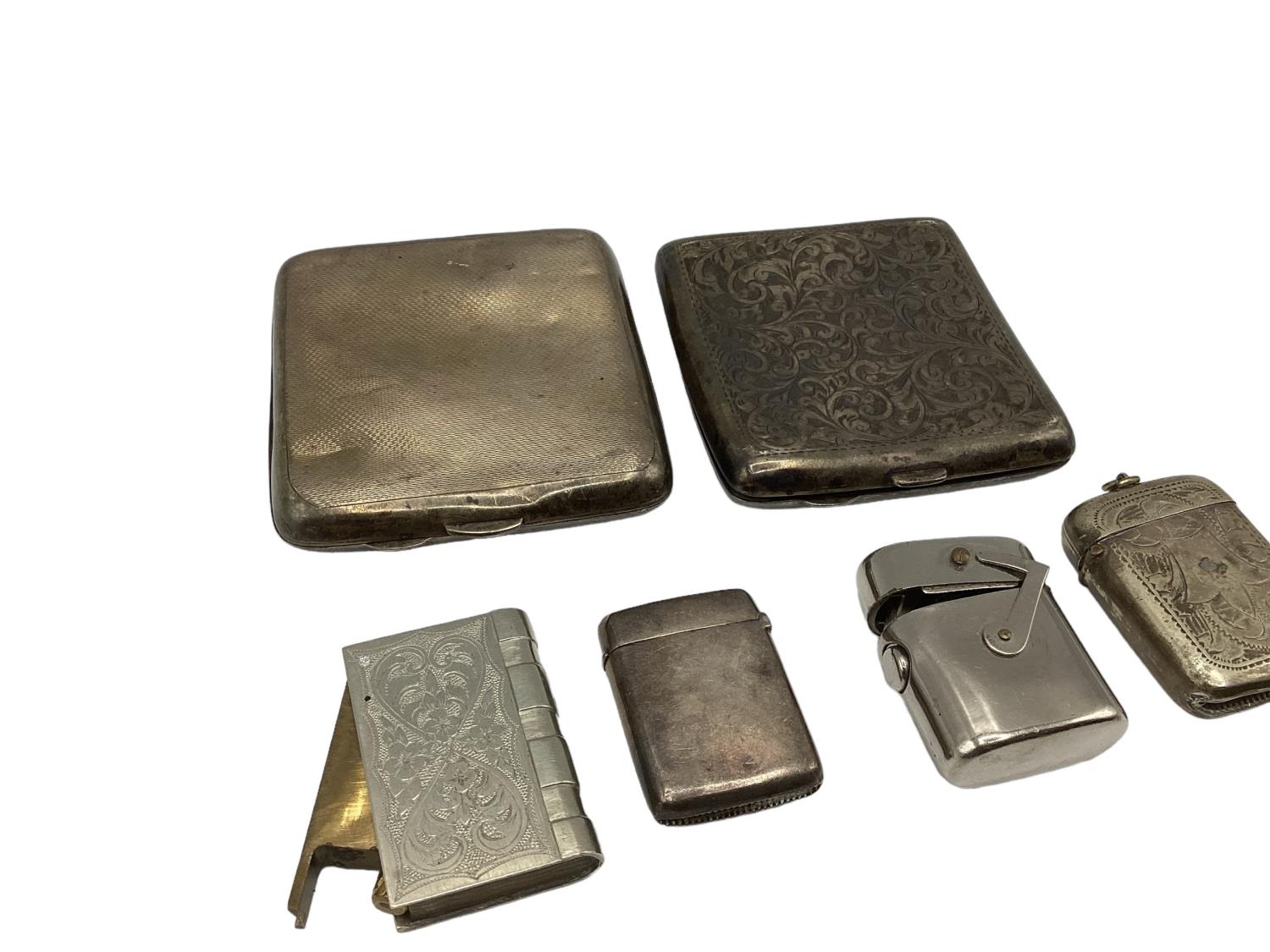 A collection of sterling silver vestas and cigarette cases together with two white metal examples. - Image 4 of 5
