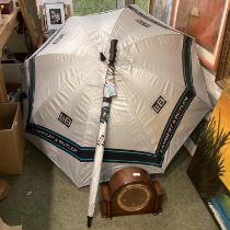 An oak cased mantle clock, and two umbrellas as new