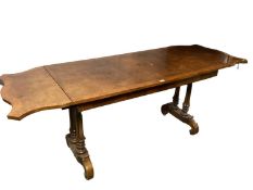 Walnut veneered library table, with two drawers to front and two drop ends, and twin column