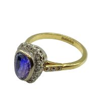 An 18ct gold and unmarked white metal sapphire and diamond ring, central pair shaped free cut