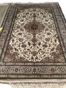 A good cream ground silk and wool style oriental rug, with all over blue and cream floral design,