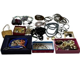 A collection of costume and bead jewellery, white metal bangles etc.