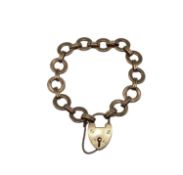 A 9ct rose gold fancy link bracelet with heart locket. 7.10g.