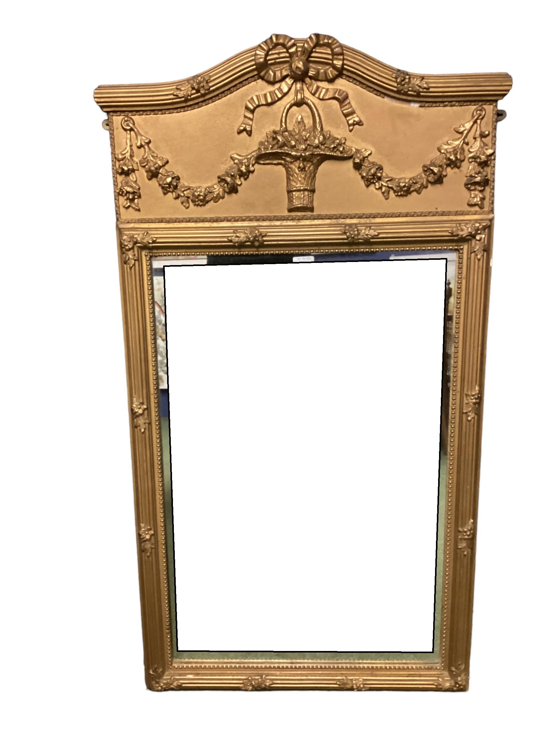 A gilt framed rectangular hanging wall mirror, with pediment to top, overall 120cm High x 64cm wide,