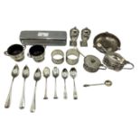 Collection of sterling silver items to include pepperettes, urn shaped salts, mustards, coin set