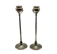 A pair of sterling silver candlesticks. Poppy head sconces. London 2000. 26cm(h). 185g.