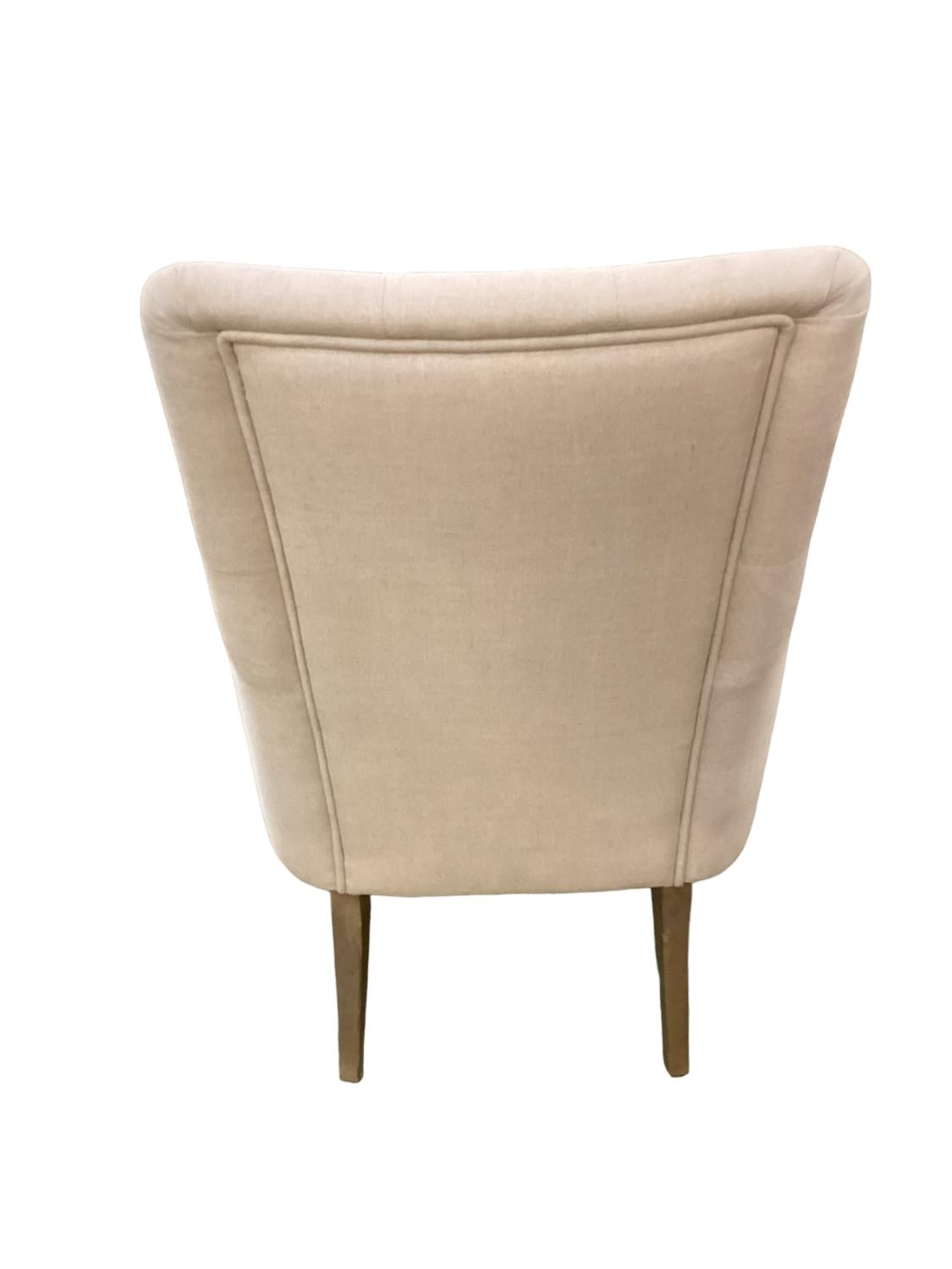 A modern cream upholstered button back chair, raised on wooden feet, some areas of wear/marks - Image 2 of 3