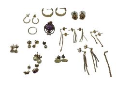 A collection of 9ct gold and yellow metal earrings together with an amethyst pendant and matching