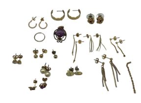 A collection of 9ct gold and yellow metal earrings together with an amethyst pendant and matching