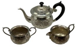 A South Asian style three piece tea set marked sterling silver to base, total 300g.