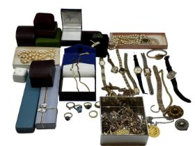 A collection of costume jewellery and watches