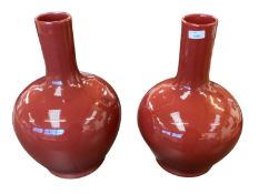 A large pair of modern sang de Boeuf style waisted vases. 43cm(h)