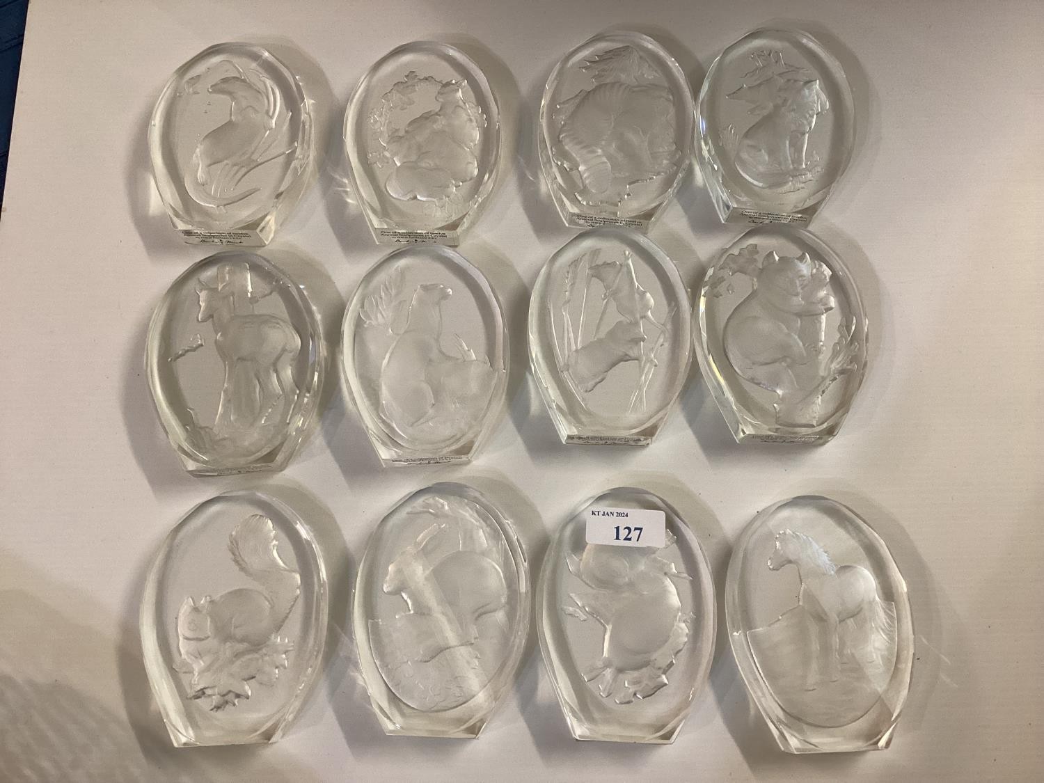 A quantity of glass paperweights, etched with animal designs, labelled " A collection of animal - Image 2 of 3